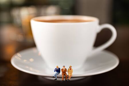 Miniature people : Coffee cup with businessman , image use for charge your energy in the morningの写真素材