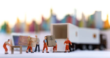 Miniature people : Worker move thing to destination place. Image use for logistic concept, shipment order from customerの写真素材