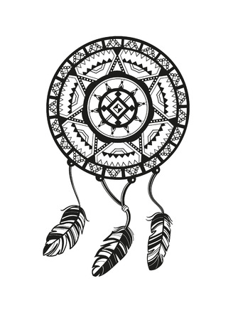 Round amulet with ethnic patterns. Ends with pendants in the form of feathersの写真素材