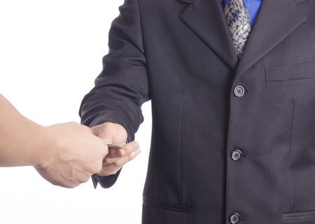 Business men exchange their business cards for first meeting on white ground.の写真素材