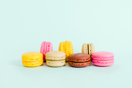 Tasty colorful macaroon on aquamarine color backgroundの写真素材