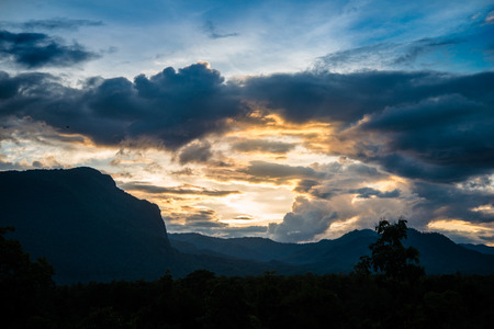 High mountain with clouds in twilight skyの写真素材