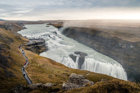 Gullfoss waterfall with yellow field in autumn season, Icelandの写真素材