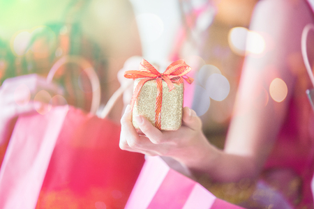 Gift box on her hand received during the festivalの写真素材