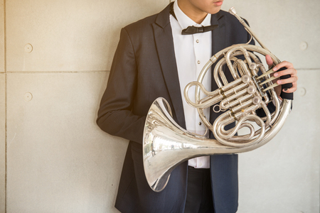 French horn music instrument orchestra classic hornist and player.の写真素材