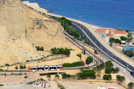 high-speed train traveling by train along the coast. Alicante, Spainの写真素材