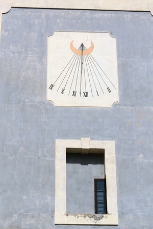 Sundial on the wall of the old castles in Europe