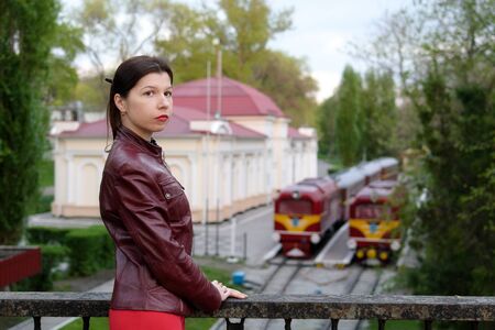 Beautiful young Caucasian woman in park in spring.