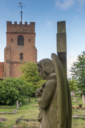 old angel in a church graveyard in Englandの写真素材