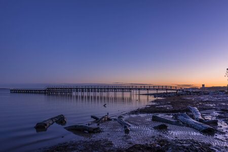 Pier Grantville early morning with logs in foregroundの写真素材