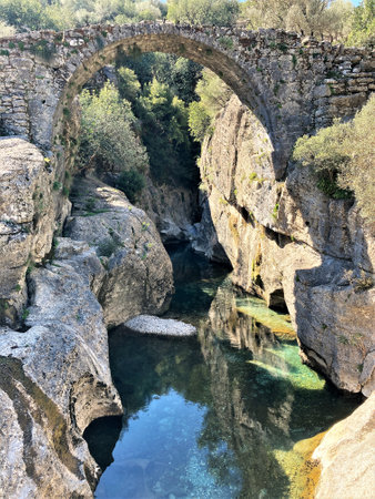 Old stone bridge over a river in Turkeyの写真素材