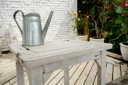 watering can on white tableの写真素材