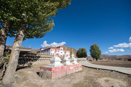 Daocheng, China - October 21, 2015: Buildings in Banghe village at Daocheng Township, Sichuan Province, China on October 21, 2015. Banghe Village is composed of river, farmland, birch forest, hamlet and temples.のeditorial素材
