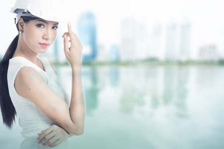 Female engineer with blur buildings backgroundの写真素材