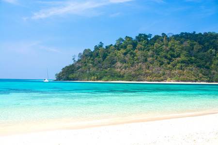 Island and sea beach with clear blue waterの写真素材