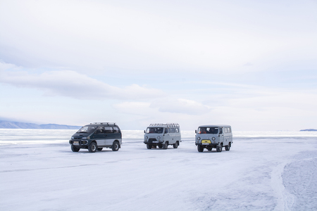 Baikal Lake, Siberia, Russia - February 23, 2019: Cars are parked on frozen lake in Russia on February 23, 2019のeditorial素材