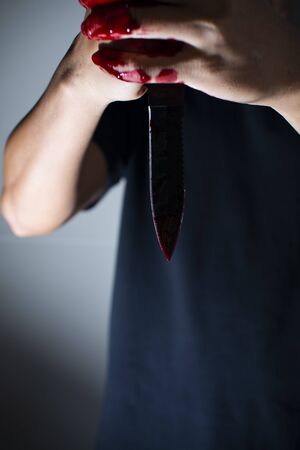 Psychotic murderer is killing someoneの写真素材