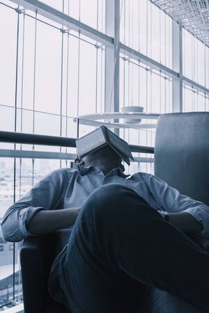 Bangkok, Thailand - May 5, 2018: A man is sleeping in an office on May 5, 2018 in Bangkok, Thailand
