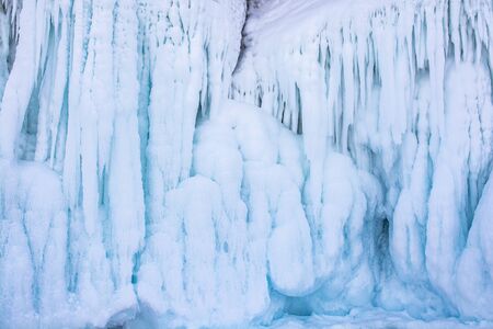 Blue ice stalactite on cliff, winter season in Siberia, Russia, nature background image の写真素材