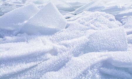 Broken ice on surface of frozen lake in Russia, Baikal Lake in winter, landscape photography