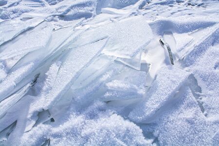 Broken ice on surface of frozen lake in Russia, Baikal Lake in winter, landscape photographyの写真素材