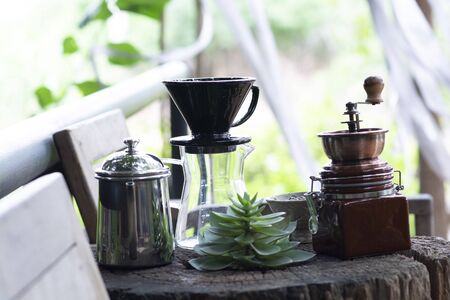 Dripped coffee equipment on wooden tableの写真素材
