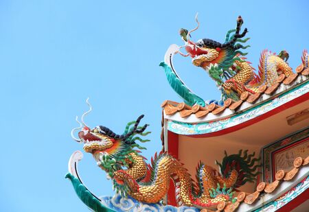 Two colorful Dragon on roof at Chinese Temple.