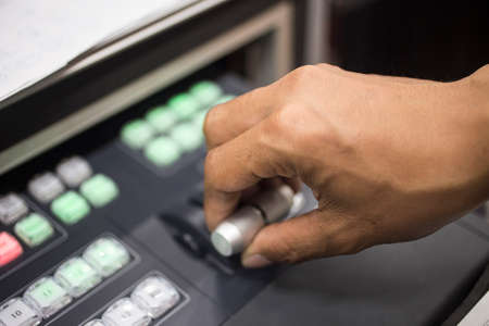 Close-up LED Display Switching, Controls on the screen. Hand on the control. The control panel to...