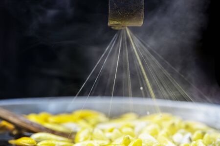 Close up of Traditional Thai silk in roll, cocoon of silk golden worm. Golden worm cocoon were boiled for threshing or rubdown silk fibre. Thailand. Selective focus.の写真素材