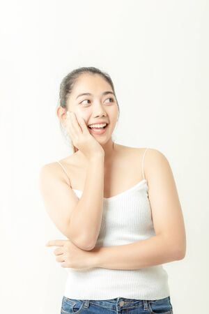 Asian woman is showing off pretty skin. Asian beauty skin care woman looking at side.の写真素材