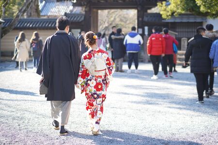 Japanese couples Wearing a national costume kimono to take photos at The outside Kinkakuji Temple are Popular tourist spots in Kyoto, Jan 30, 2019 in Kyoto, Japan.のeditorial素材