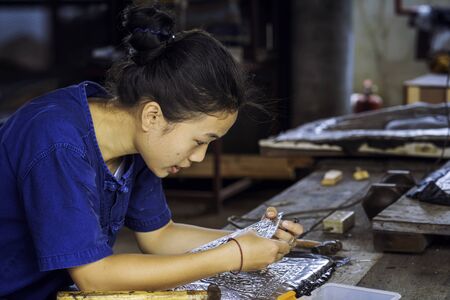 Silverware making. Thai craftman are making silverware. The original of the silver craftsmen on Wua...