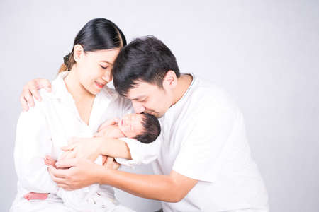 Portrait of young family with little son.