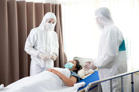 Doctors and staff to prevent COVID 19 Checking and treating patients in a controlled area, state quarantine.の写真素材