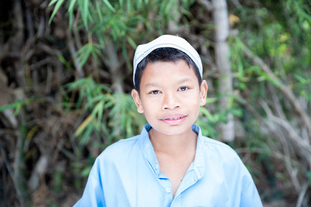 Islamic boys smiling in the bamboo forestの写真素材