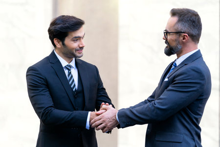 Business Handshake Agreement Partnership. Business people shaking hands and finishing up a meeting.
