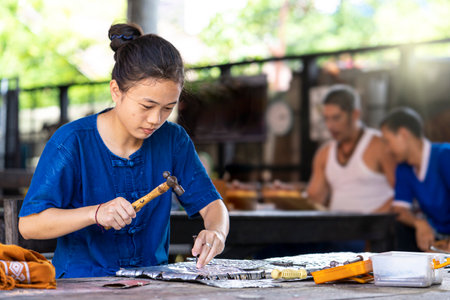 Craftsmen making silverware. Silvermaker. Silversmiths tools on the silver workplace. Silversmith...