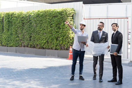 Engineer installing solar panels on a roof house for alternative energy photovoltaic safe energy. Employees are checking the operation of the solar panel.の写真素材