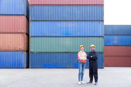 Import and export logistic transportation concept. Container Shipping Logistics of import and export transportation industry. Foreman and manager work stand in front of cargo containers.の写真素材
