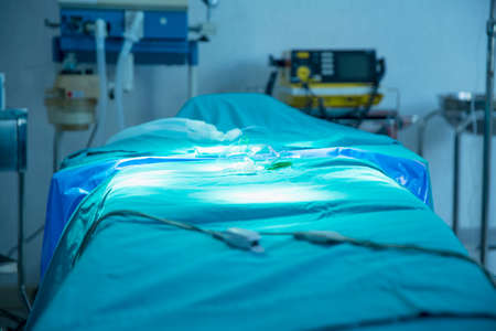 Patient beds in the emergency room without people. Hospital emergency operating room.