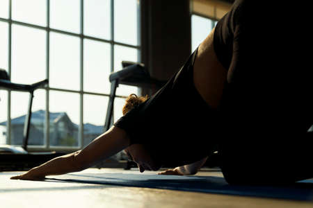 A young woman doing yoga.  Sporty woman practicing yogaの写真素材