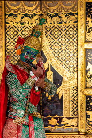 Giant carrying a fan. Ramayana story. The battle of Rama. Thailand Dancing in masked perform a Thai traditional masked ballet (Khon).の写真素材