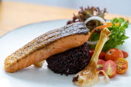 Salmon Don, Fusion Food. Braised grilled salmon with black rice.の写真素材