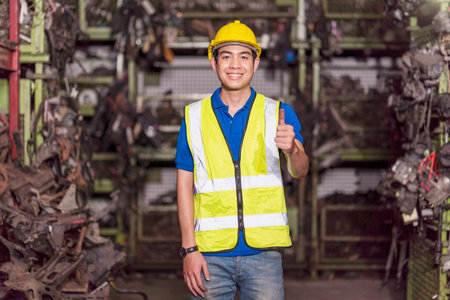A skilled engineer or technician is giving a thumbs up. Factory worker show thumb up.の写真素材