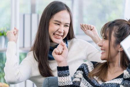 Couple women rejoicing. Two Young Woman Talking and rejoicing.