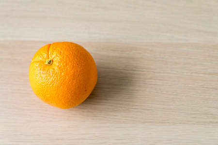 Orange on the wooden floor. Fresh Orange on the wooden table.の写真素材