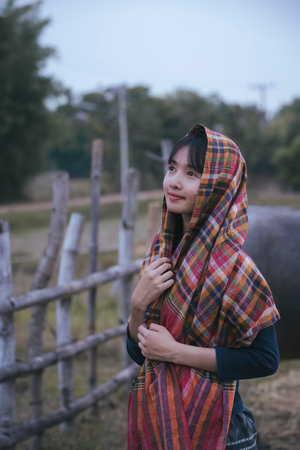 Rural girl Use a loincloth to cover in winter. Thailand.の写真素材