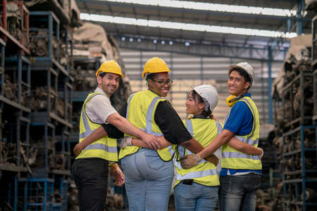 Unity of factory workers. Professional factory workers standing together.