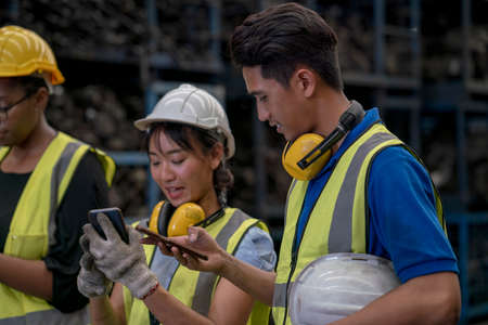 Engineers or technicians are inspecting auto parts in warehouses and factories. Factory technician...