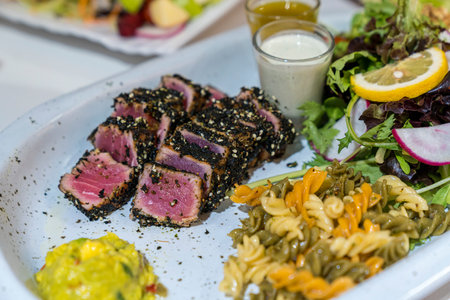 Steak Tuna Salad. Sliced Tuna Steak with salad and ingredients.